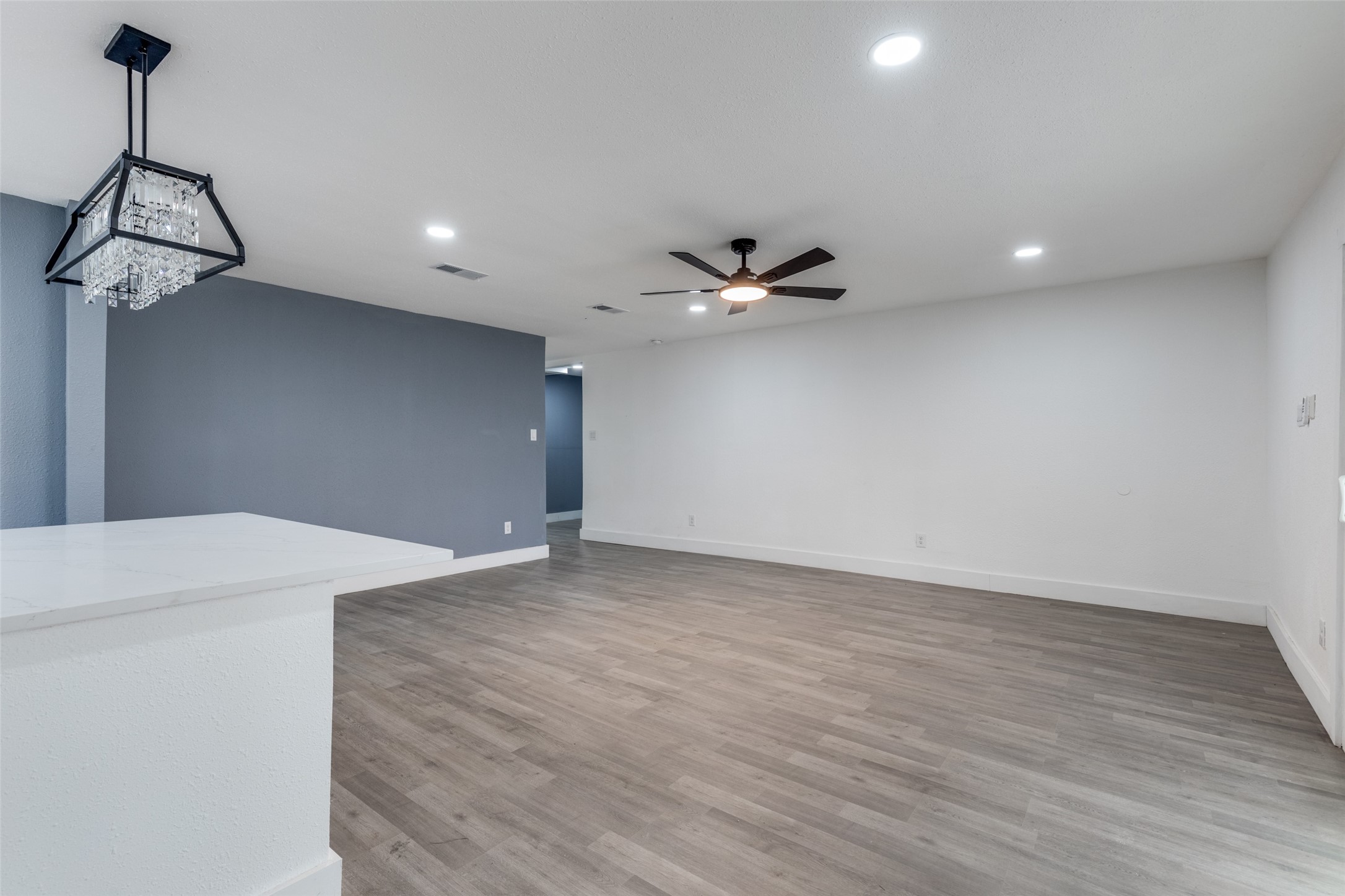23115 Lestergate Drive Spring, TX 77373 - Photo 15 of 25 a view of a room with wooden floor and ceiling fan