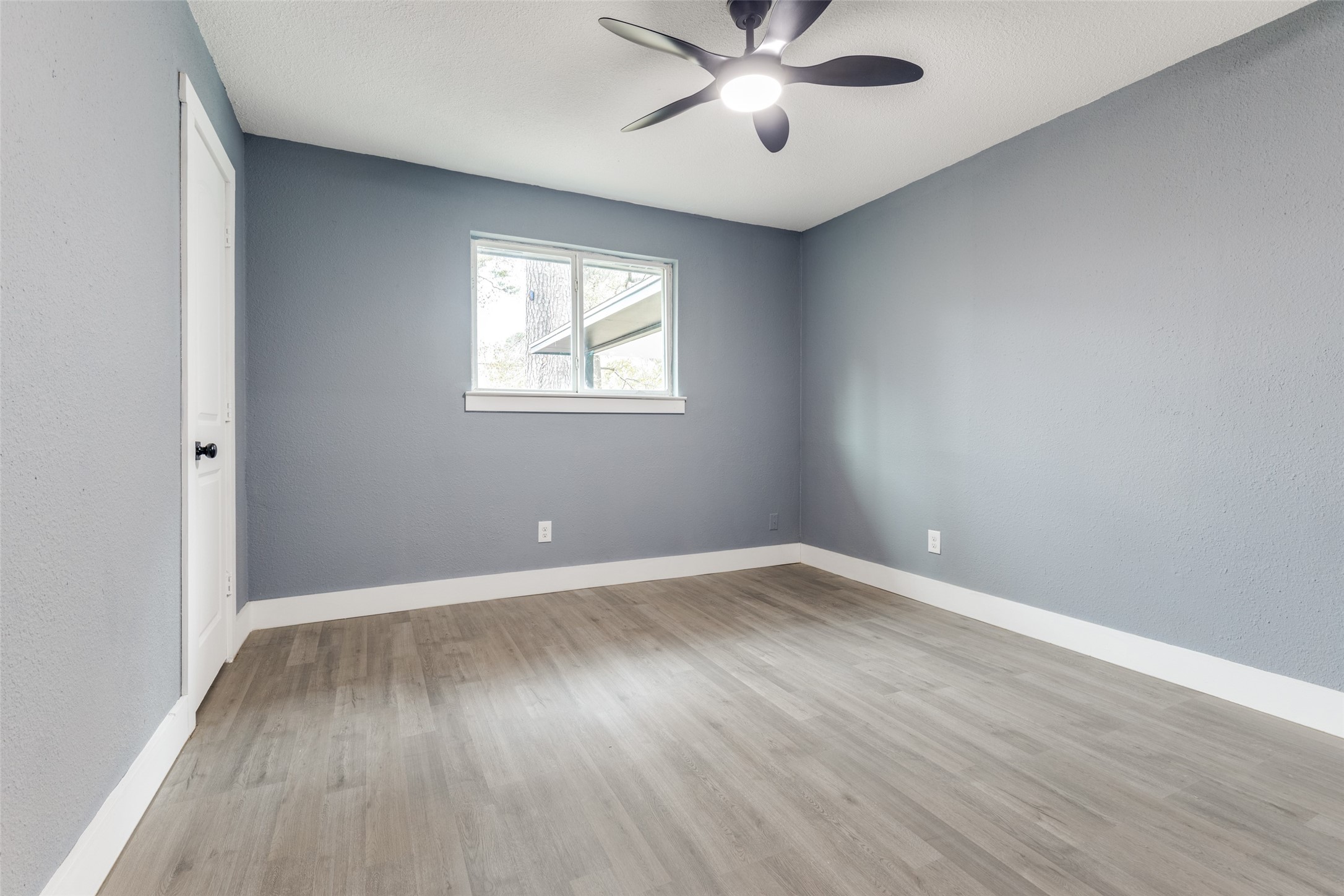 23115 Lestergate Drive Spring, TX 77373 - Photo 19 of 25 wooden floor in an empty room with a window