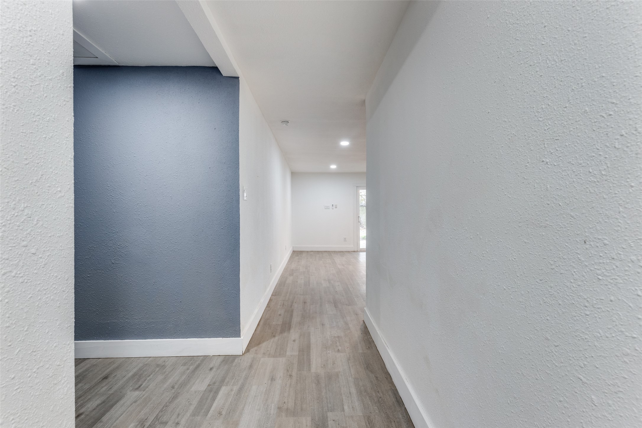23115 Lestergate Drive Spring, TX 77373 - Photo 5 of 25 a view of a hallway with wooden floor