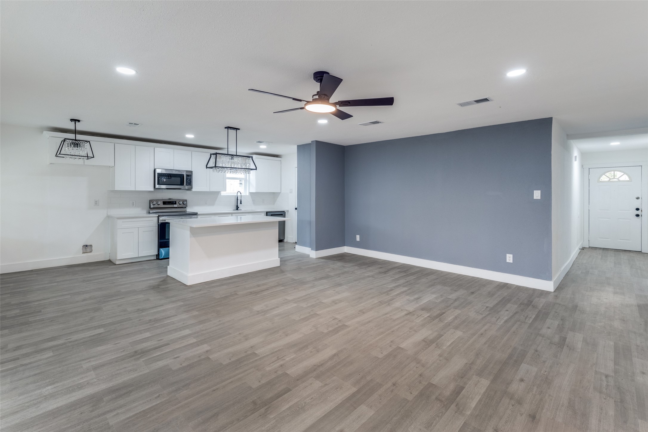 23115 Lestergate Drive Spring, TX 77373 - Photo 6 of 25 a view of a kitchen with a sink and a refrigerator