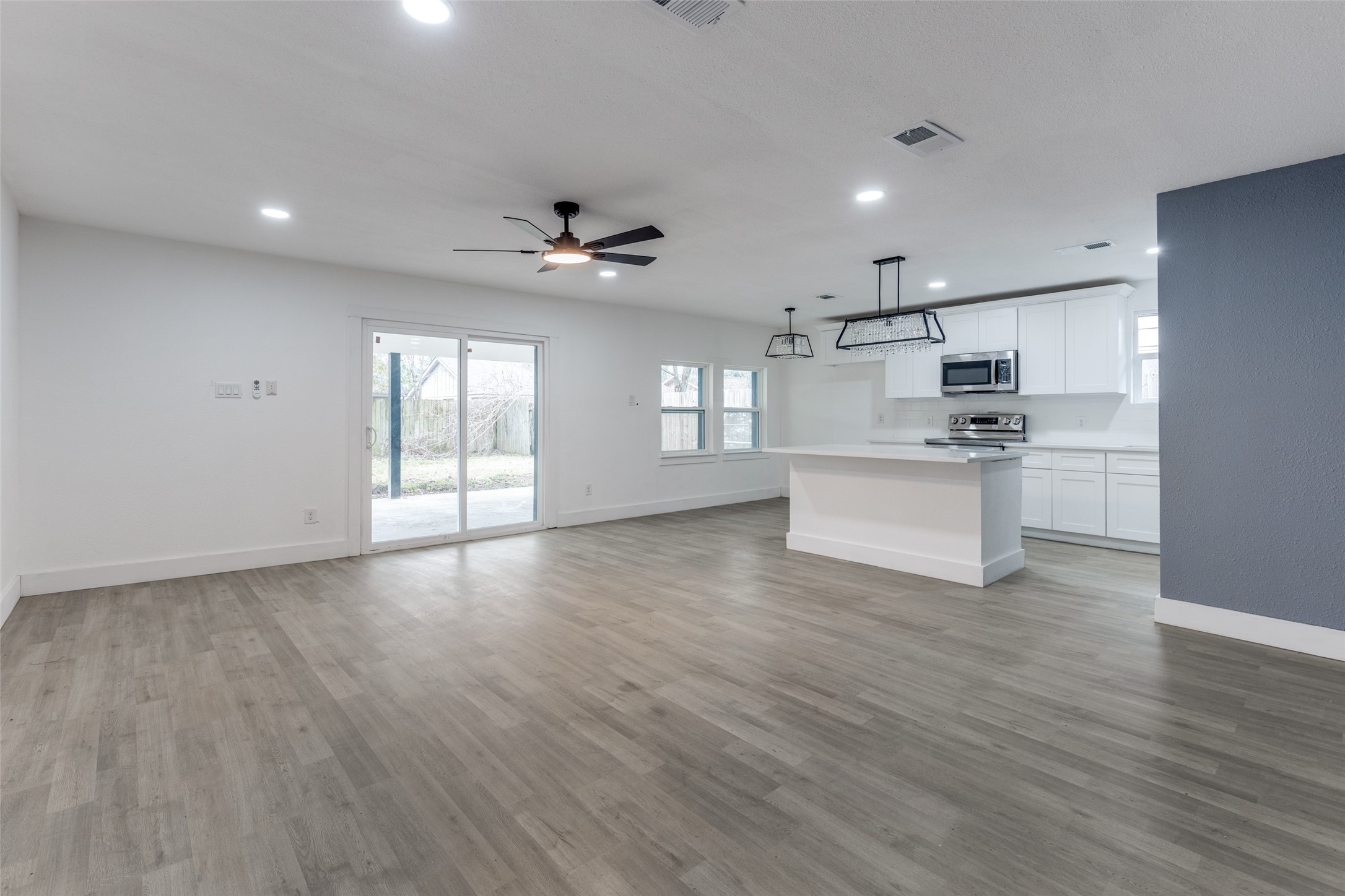 23115 Lestergate Drive Spring, TX 77373 - Photo 7 of 25 a view of a kitchen with a sink and a stove top oven