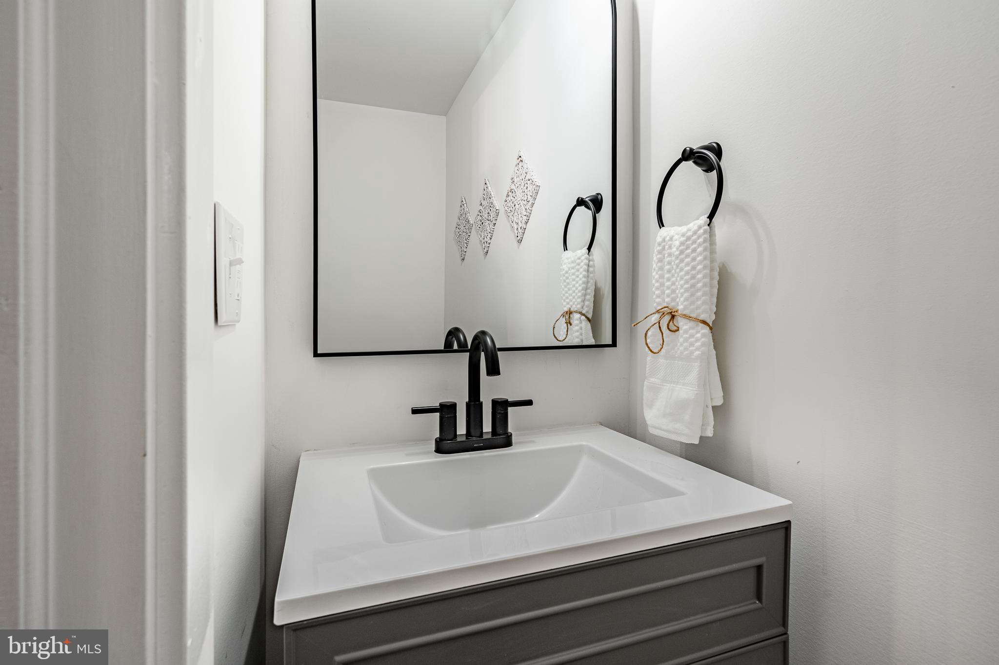 3661 St Peters Road Elverson, PA 19520 - Photo 17 of 36 a bathroom with a sink and a mirror