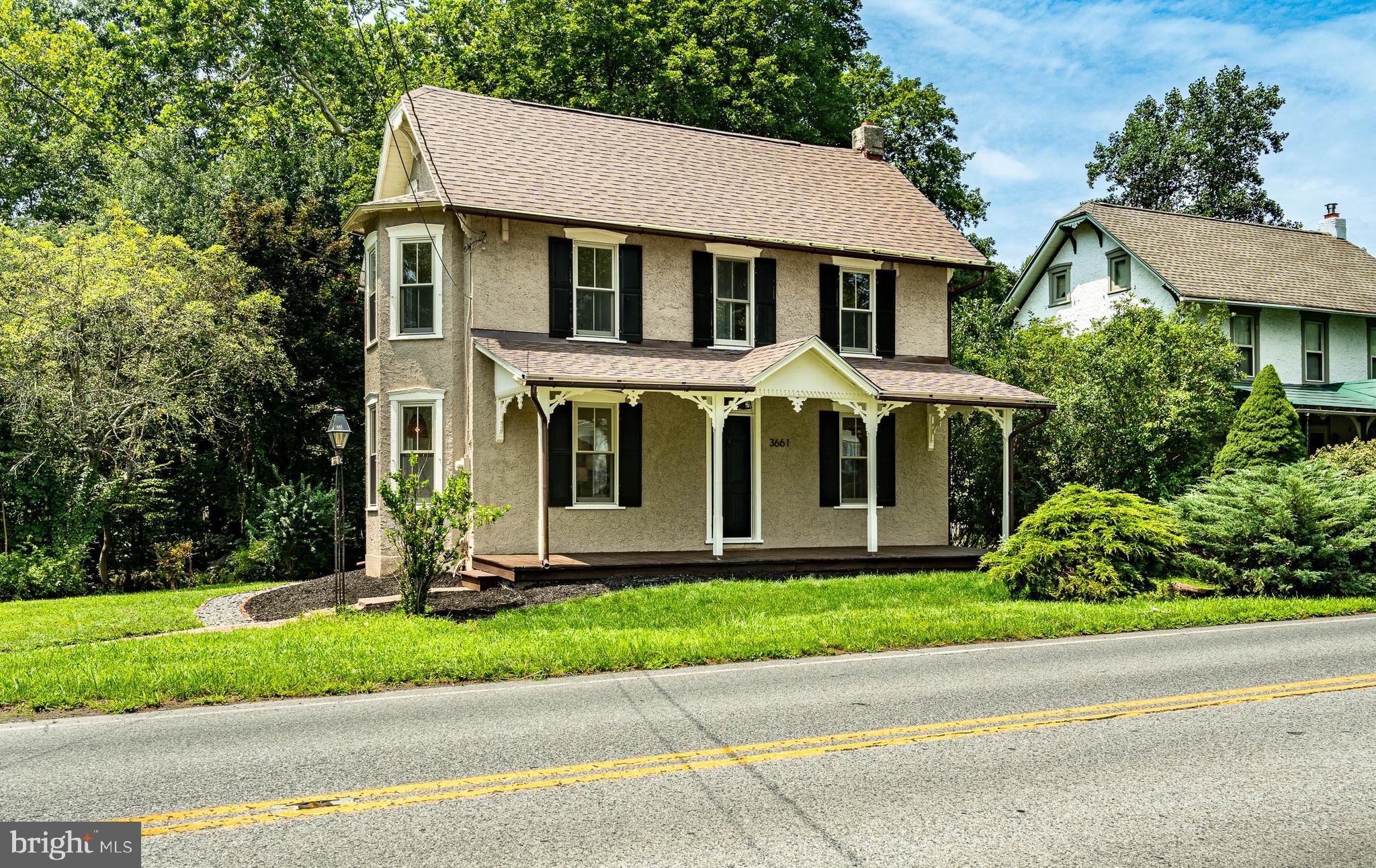 3661 St Peters Road Elverson, PA 19520 - Photo 2 of 36 a front view of a house with a yard and potted plants