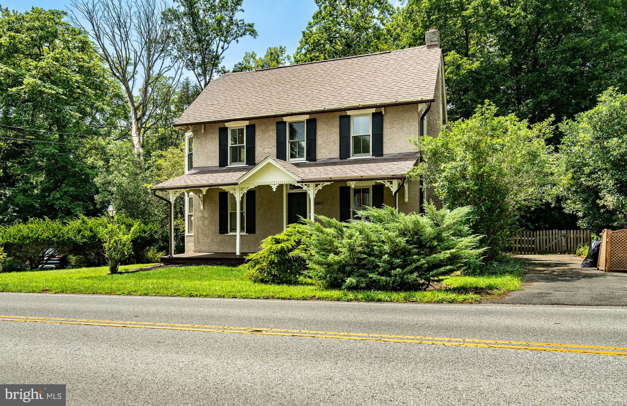 3661 St Peters Road Elverson, PA 19520 - Photo 3 of 36 a front view of a house with a garden and plants