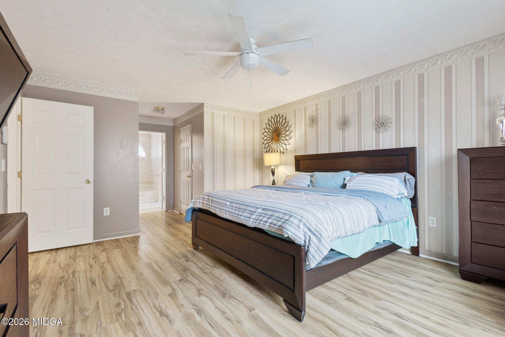 227 Dusty Lane Macon, GA 31211 - Photo 11 of 21 a bedroom with a bed and a large window