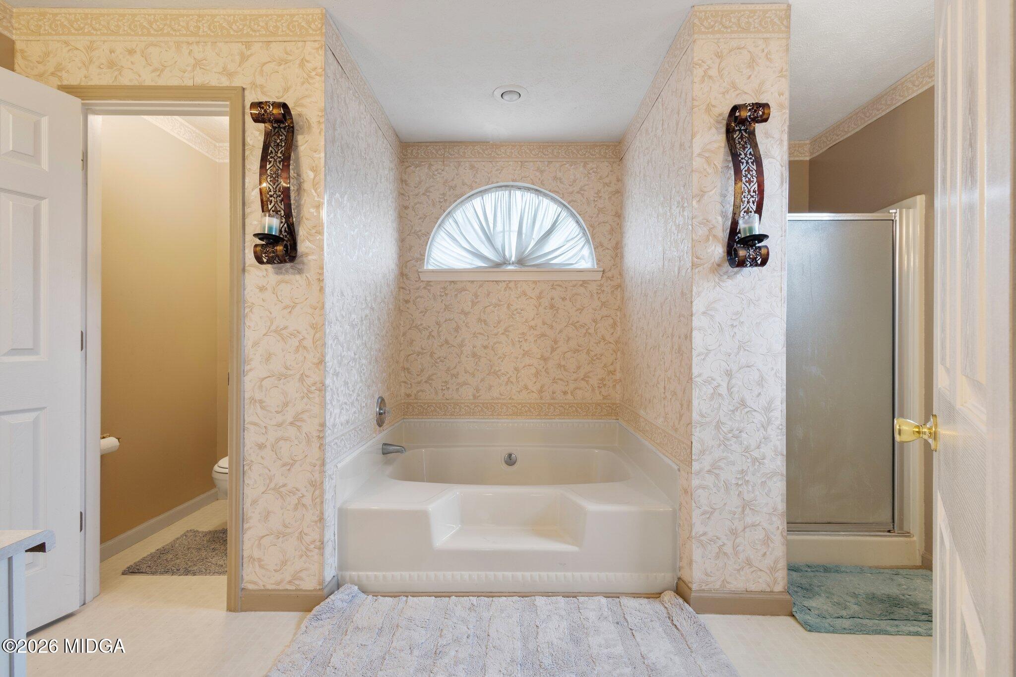 227 Dusty Lane Macon, GA 31211 - Photo 13 of 21 a bathroom with a bathtub and shower