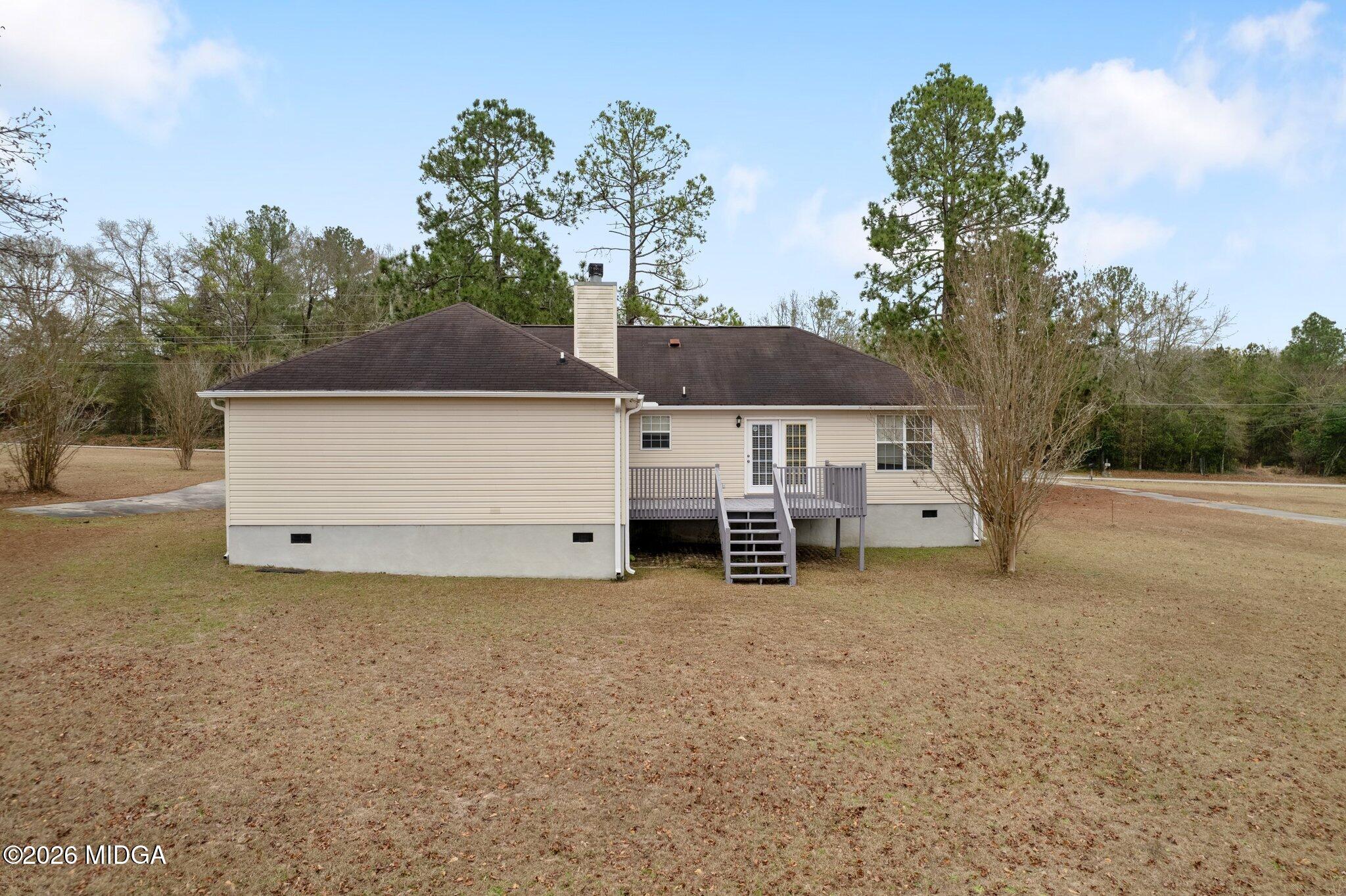 227 Dusty Lane Macon, GA 31211 - Photo 18 of 21 a view of a house with backyard and trees