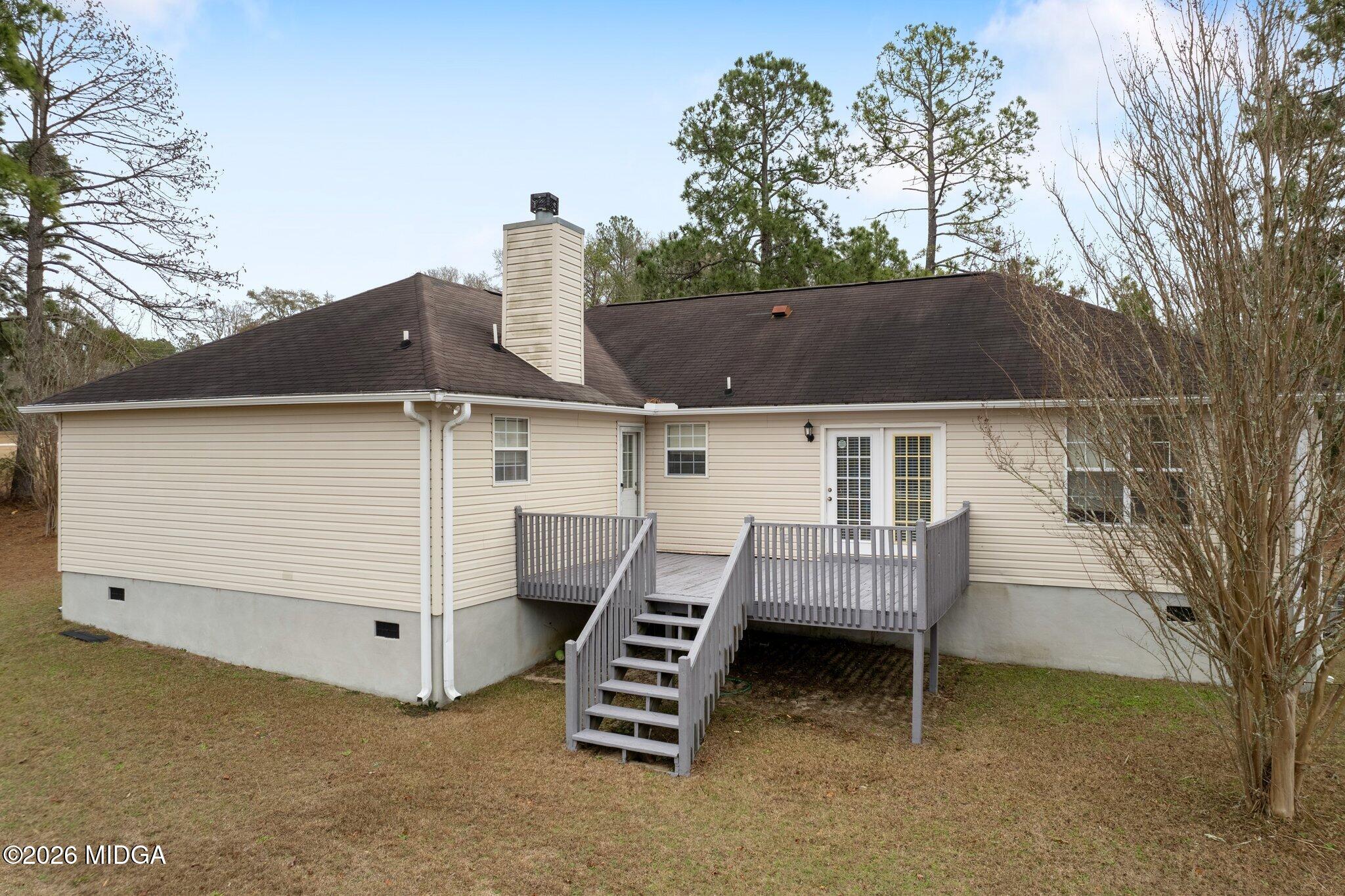 227 Dusty Lane Macon, GA 31211 - Photo 19 of 21 a view of backyard with seating space and trees