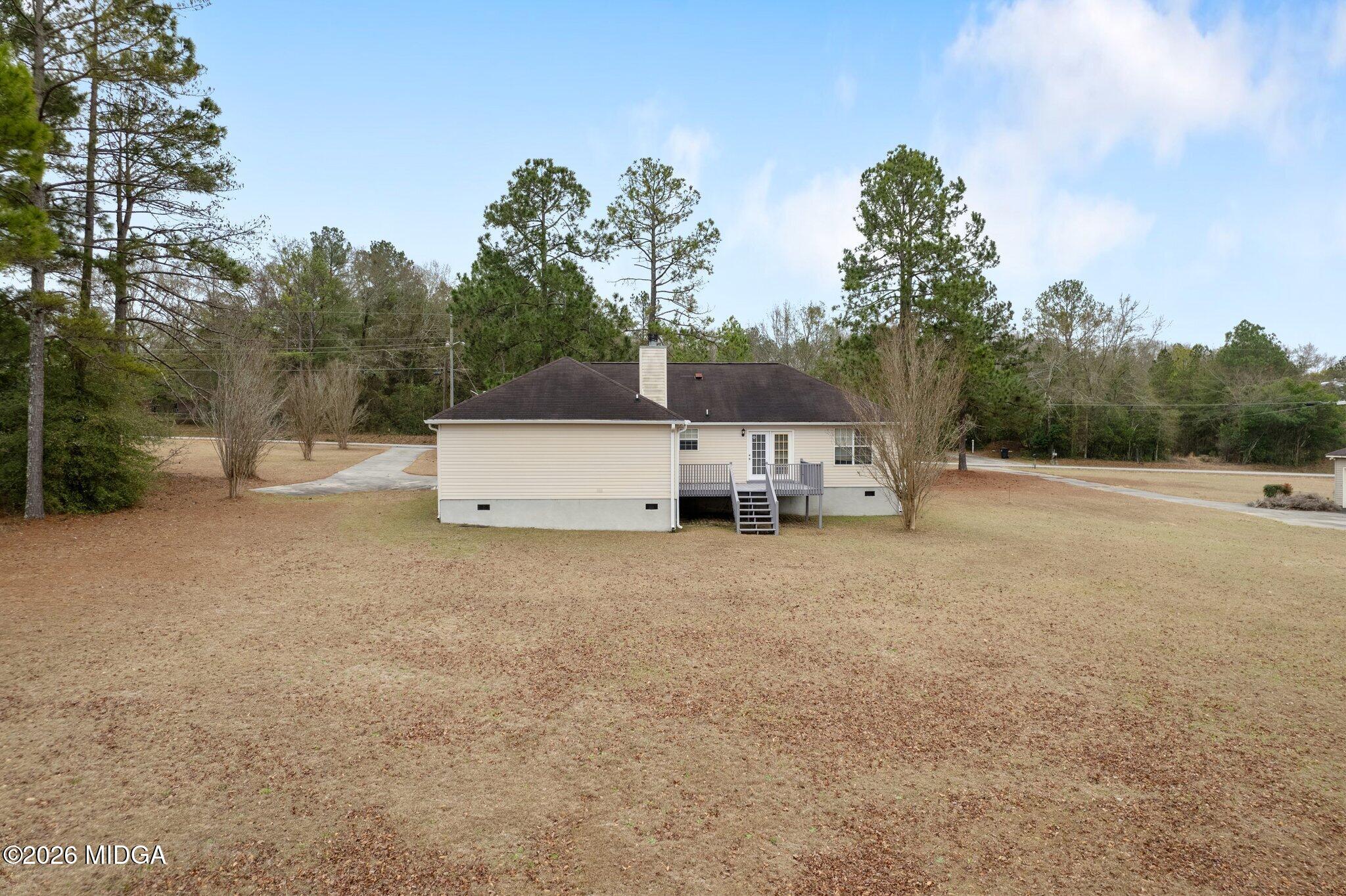 227 Dusty Lane Macon, GA 31211 - Photo 20 of 21 a view of a house with backyard and trees