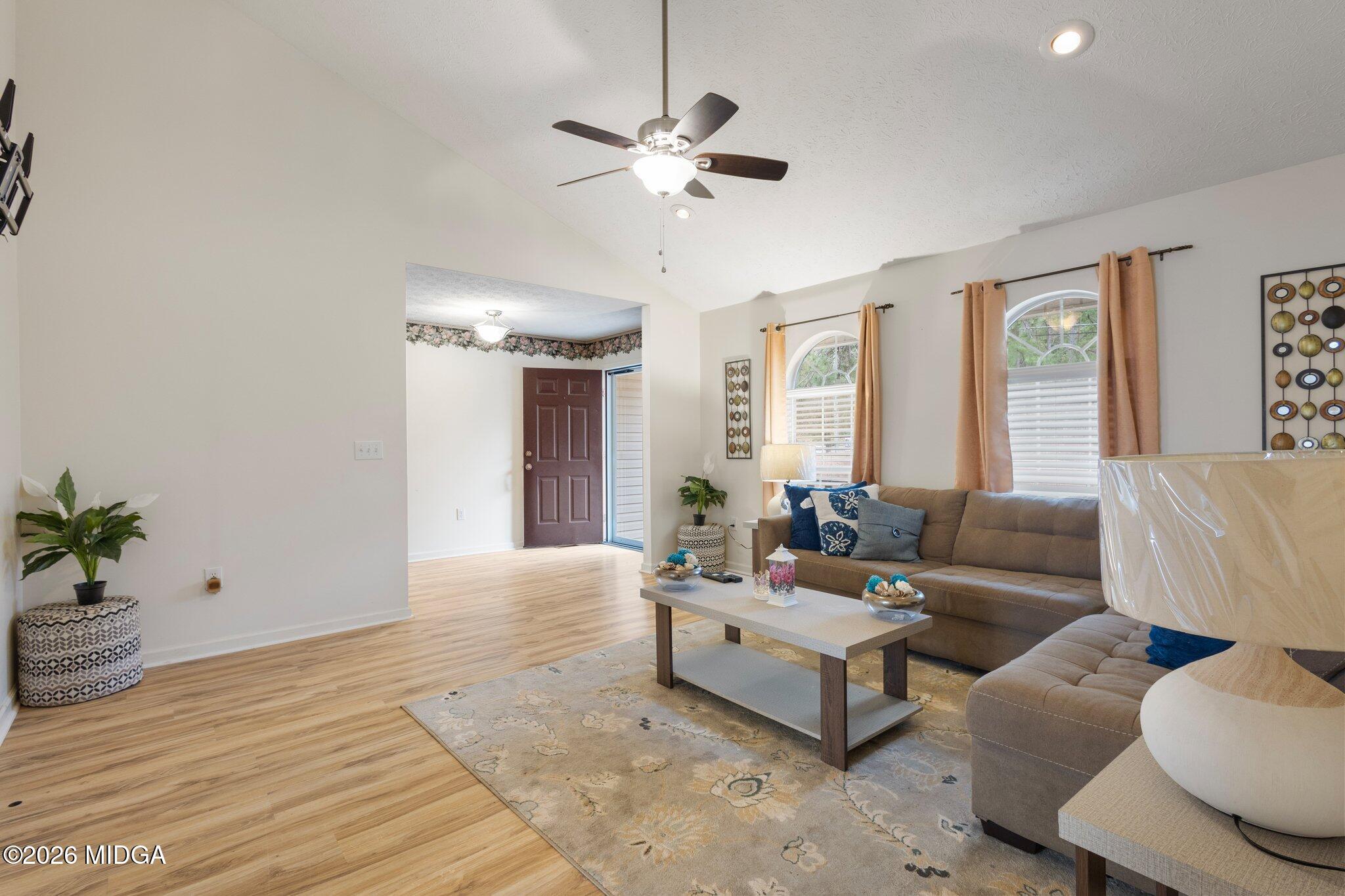 227 Dusty Lane Macon, GA 31211 - Photo 5 of 21 a living room with furniture and a large window
