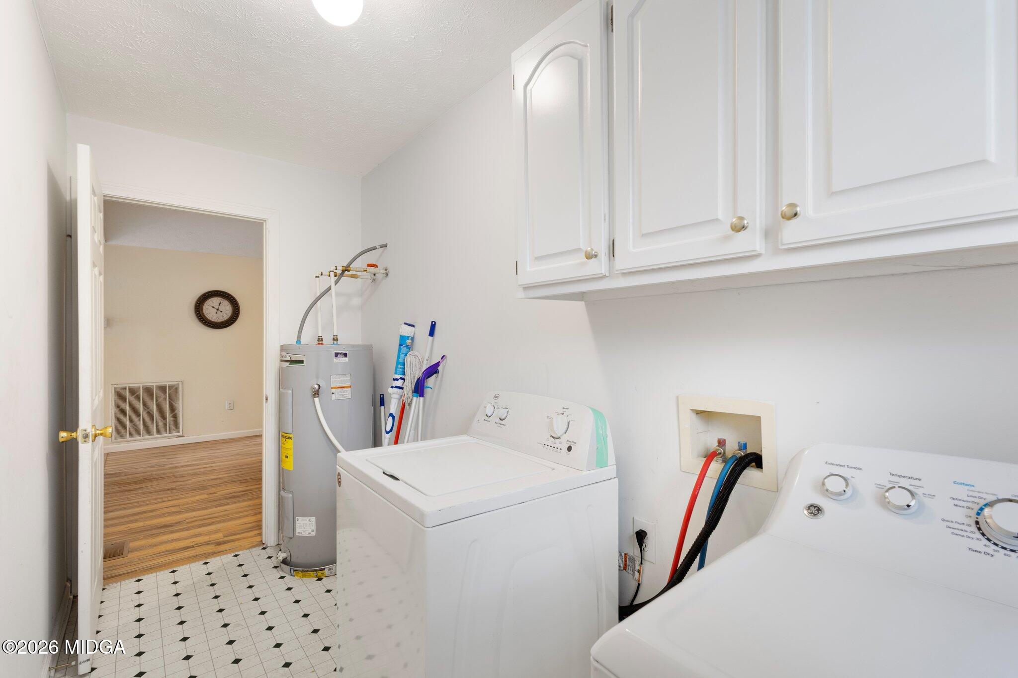 227 Dusty Lane Macon, GA 31211 - Photo 6 of 21 a view of storage and utility room with washer and dryer