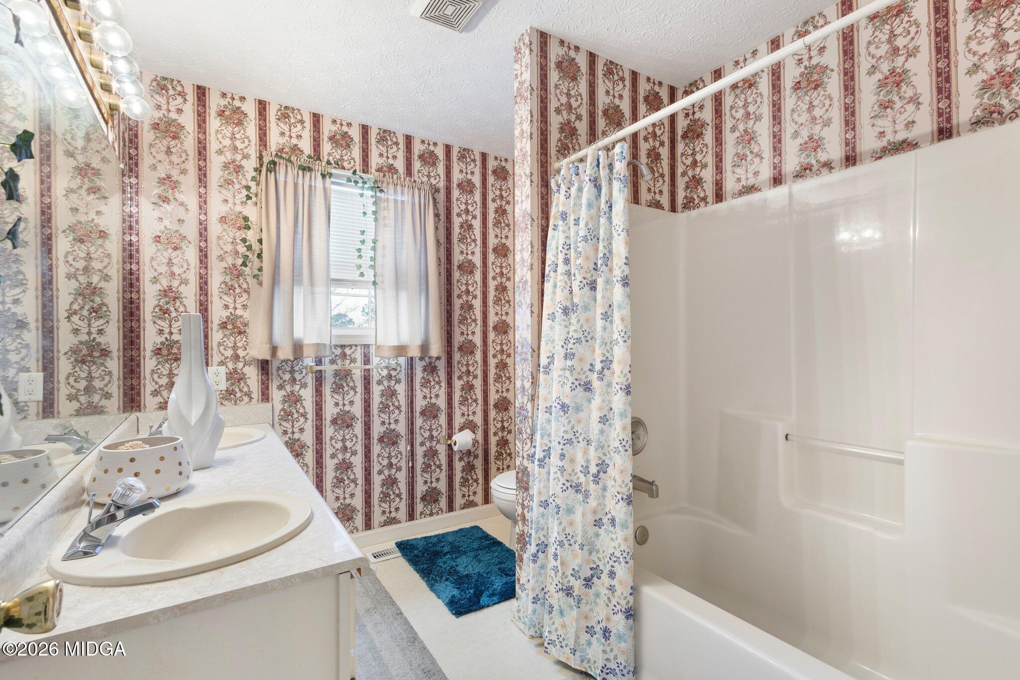 227 Dusty Lane Macon, GA 31211 - Photo 10 of 21 a bathroom with a sink and a mirror