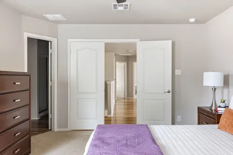 a bathroom with a granite countertop toilet sink and a bathtub