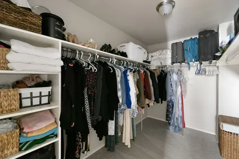 a bedroom with a bed and a table in it