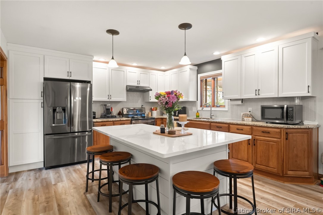 700 South 1233rd West Lexington, IN 47138 - Photo 8 of 65 Large kitchen island has awesome seating and quartz countertops!