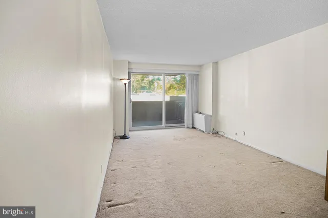 a view of a lobby with black carpet