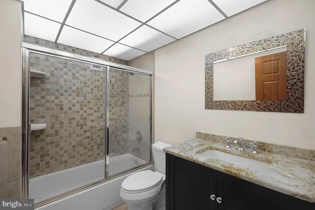 a view of a house with a porch and a car parked car