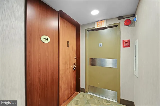 a view of a livingroom with wooden floor and stairs