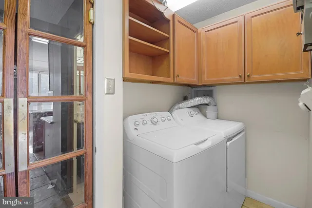 a view of an empty room with windows