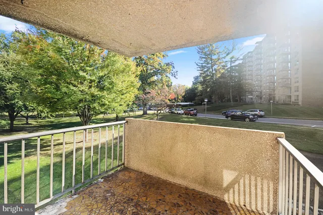 a living room with lots of furniture and a book shelf