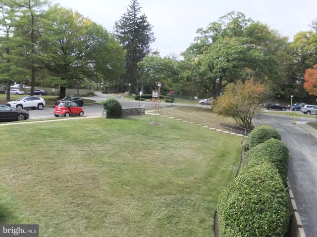 a park with slide and a bench