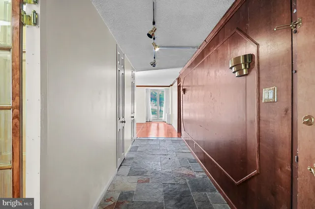 a view of a bathroom from a hallway