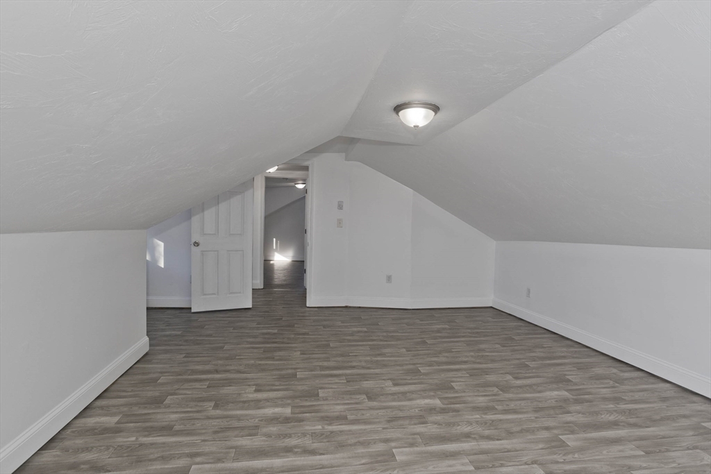 107 Eastern Avenue Worcester, MA 01605 - Photo 21 of 38 a view of a hallway with wooden floor