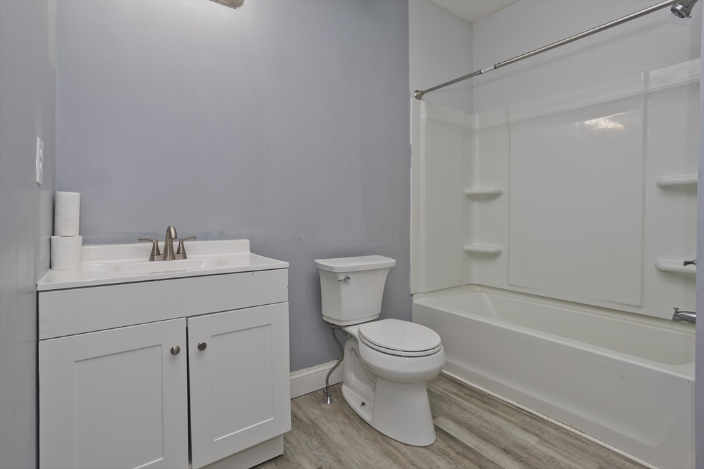107 Eastern Avenue Worcester, MA 01605 - Photo 27 of 38 a bathroom with a sink toilet and shower