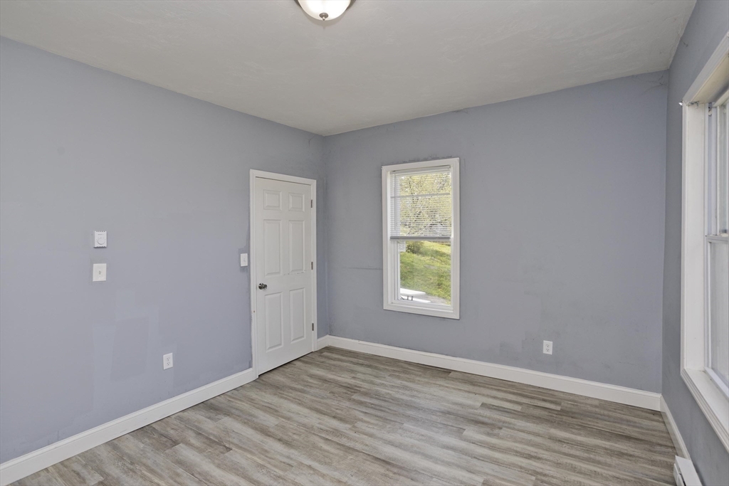 107 Eastern Avenue Worcester, MA 01605 - Photo 29 of 38 an empty room with a window
