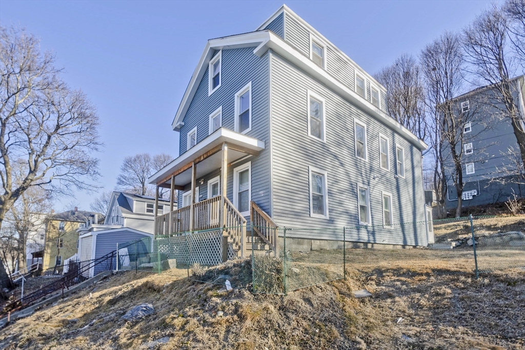 107 Eastern Avenue Worcester, MA 01605 - Photo 36 of 38 a view of a house with a yard