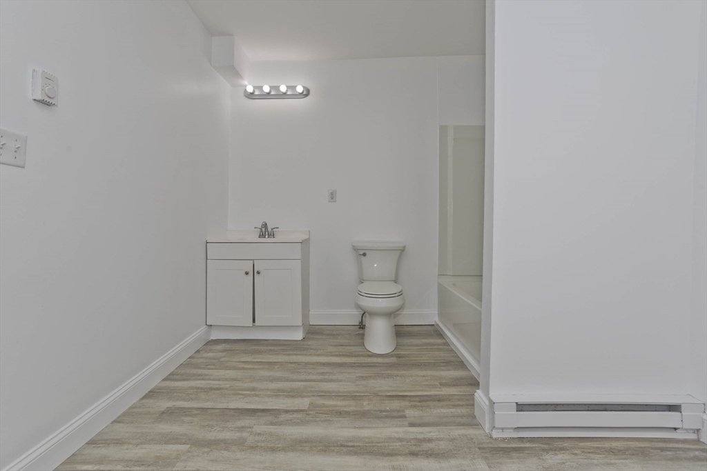 107 Eastern Avenue Worcester, MA 01605 - Photo 9 of 38 a bathroom with a sink and a toilet