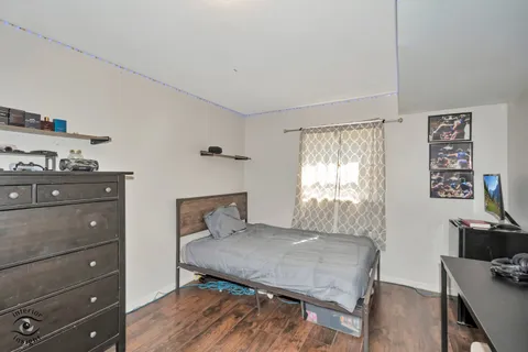 a bedroom that has a bed and a table in it