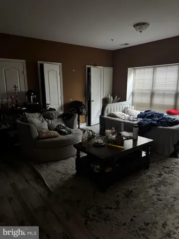 a living room with hard wood floor