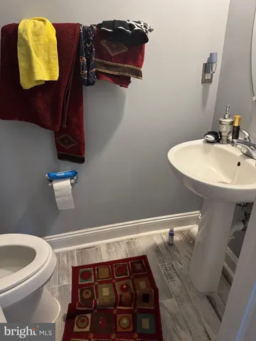 a bathroom with a toilet and a sink