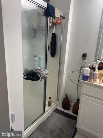 a bathroom with a toilet and a mirror