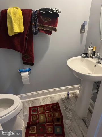 a bathroom with a toilet and a sink