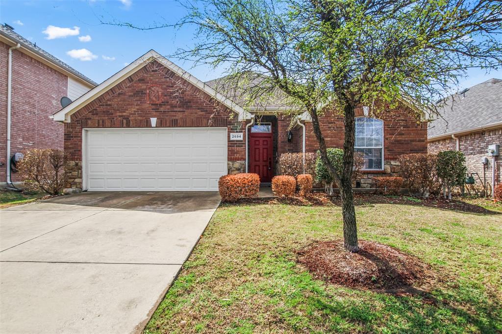 2694 Lake Ridge Drive Little Elm, TX 75068 - Photo 1 of 1 a front view of a house with a yard and garage