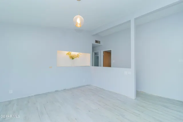 a view of an empty room and window