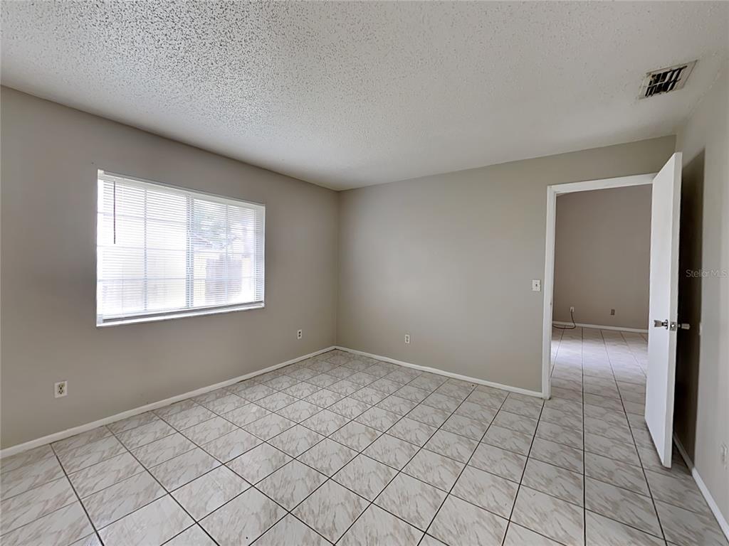 1921 Truman Road Orlando, FL 32807 - Photo 11 of 19 a view of an empty room and window