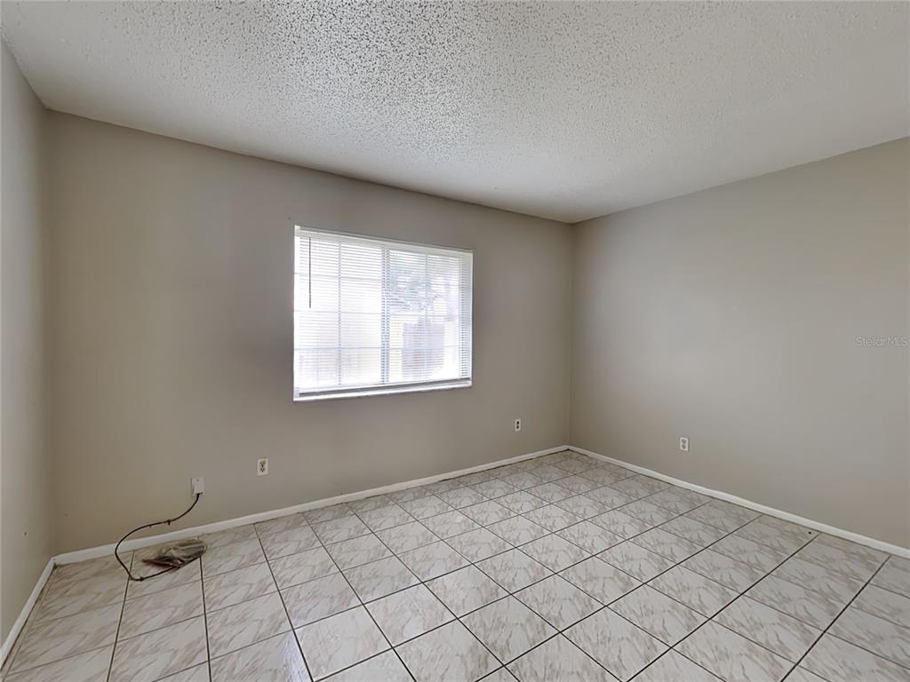 1921 Truman Road Orlando, FL 32807 - Photo 12 of 19 a view of an empty room and window
