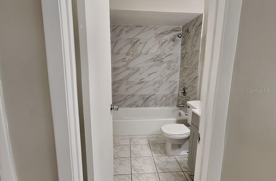 1921 Truman Road Orlando, FL 32807 - Photo 15 of 19 a bathroom with a toilet and a shower