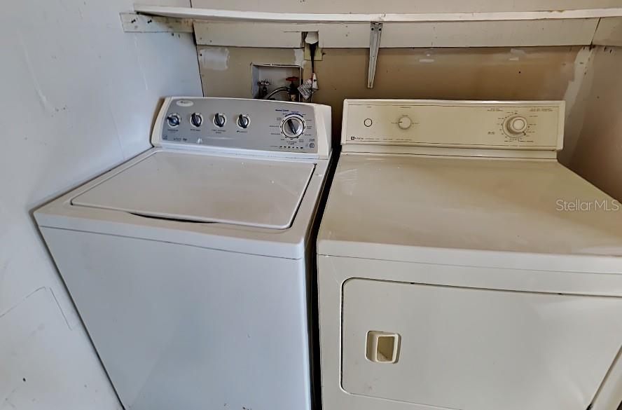 1921 Truman Road Orlando, FL 32807 - Photo 16 of 19 a utility room with dryer and washer