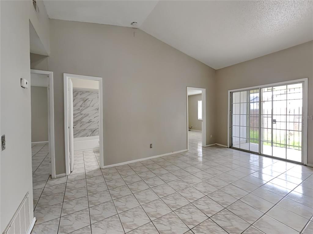 1921 Truman Road Orlando, FL 32807 - Photo 6 of 19 a view of an empty room with window