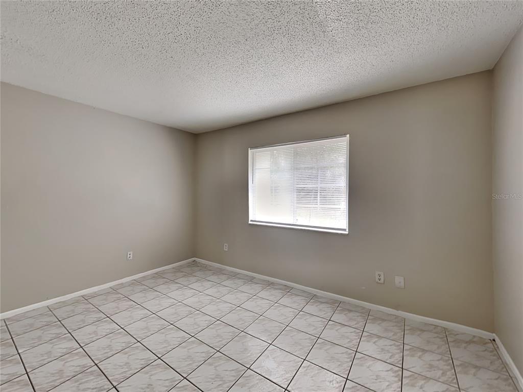 1921 Truman Road Orlando, FL 32807 - Photo 8 of 19 an empty room with windows