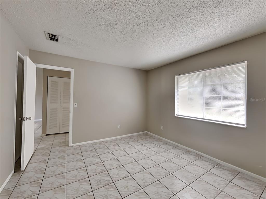 1921 Truman Road Orlando, FL 32807 - Photo 9 of 19 a view of an empty room and window
