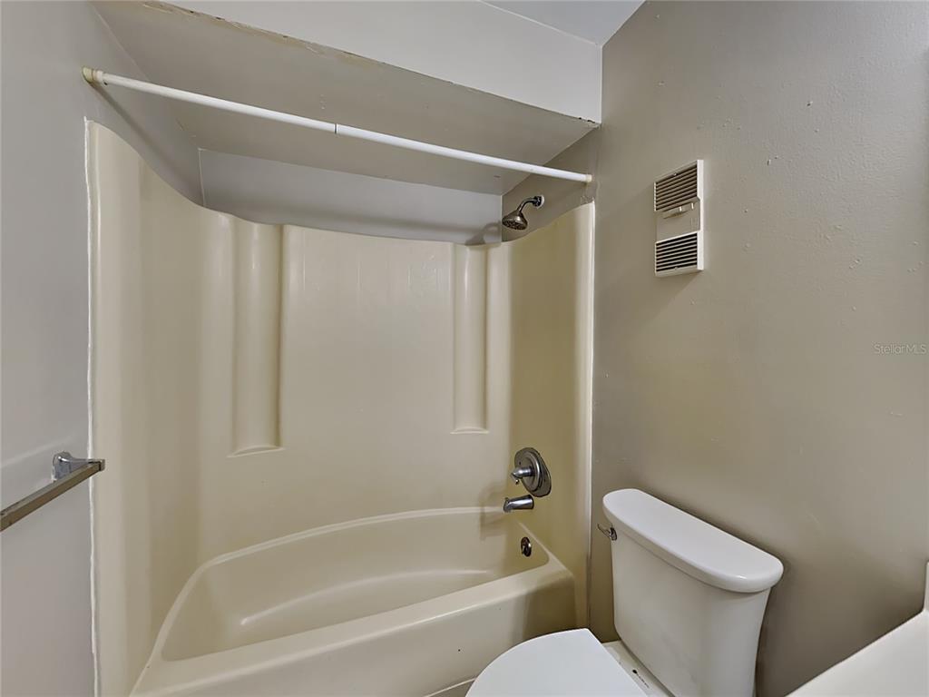 1921 Truman Road Orlando, FL 32807 - Photo 10 of 19 a bathroom with a toilet and a bathtub