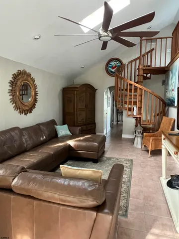 a living room with furniture and a clock