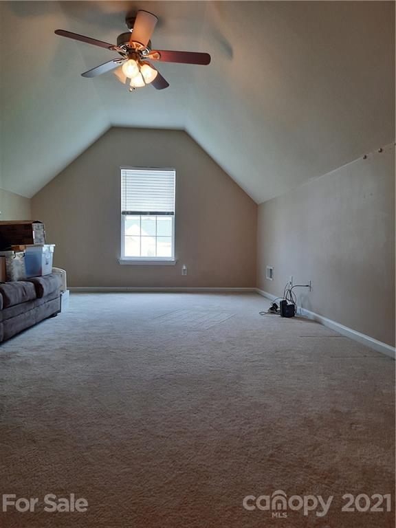 144 Bluffton Road Mooresville, NC 28115 - Photo 15 of 16 a view of room with a ceiling fan and a window