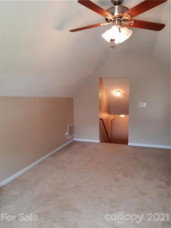 144 Bluffton Road Mooresville, NC 28115 - Photo 16 of 16 a view of an empty room with a chandelier fan