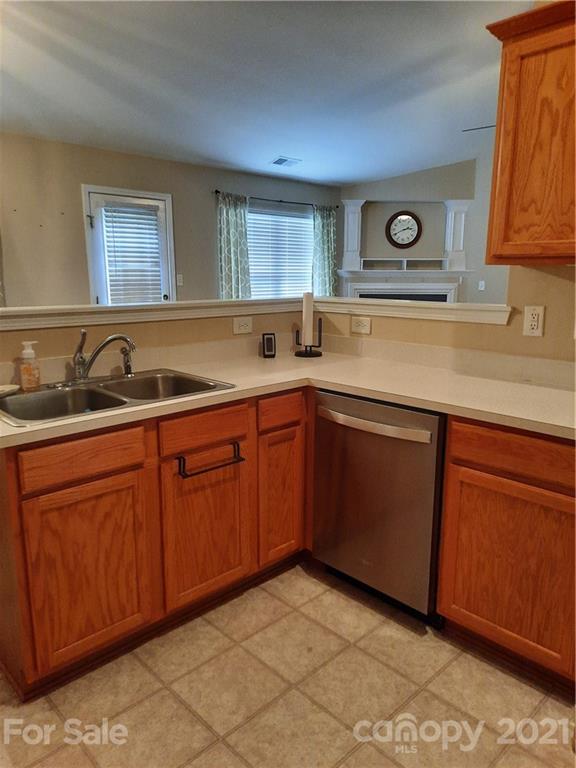 144 Bluffton Road Mooresville, NC 28115 - Photo 7 of 16 a kitchen with sink and cabinets